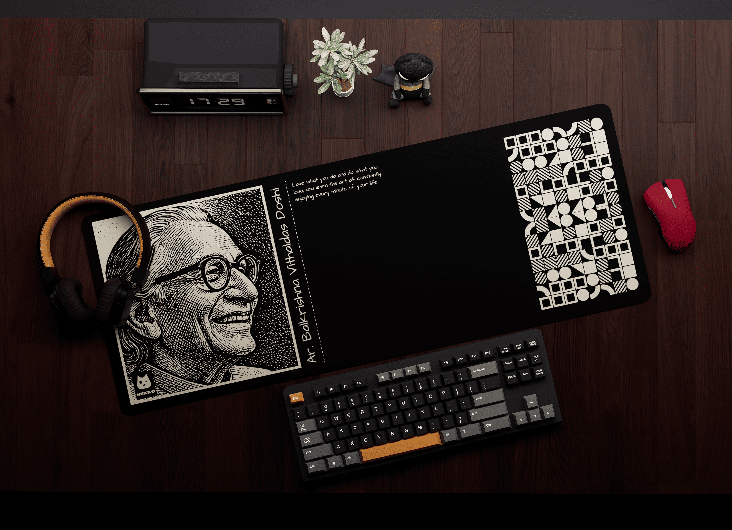 Ar. B. V. Doshi desk mat on workspace setup with keyboard and mouse