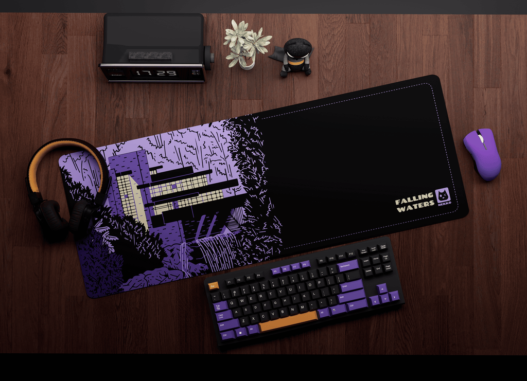 The Falling waters desk mat on workspace setup with keyboard and mouse